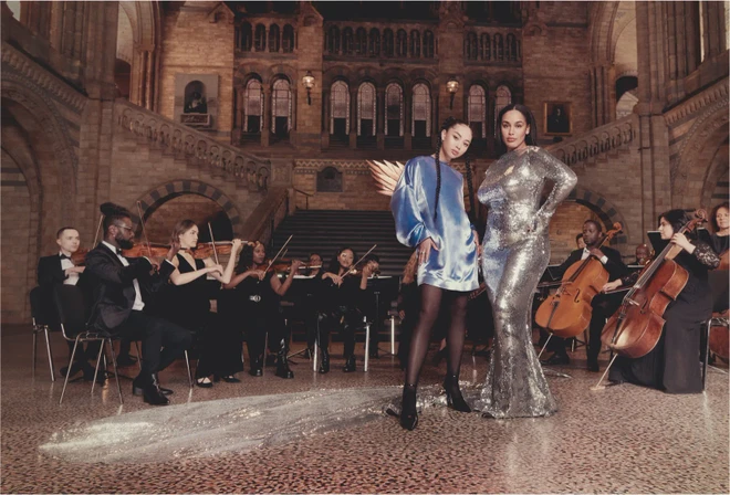 Photographer Charlotte Wales captured friends of Vogue for a shoot introducing the concept for Vogue World: London. Here, Griff and Jorja Smith pose with Chineke! Orchestra in the Natural History Museum. Out of shot? An 80-foot-long blue whale skeleton, suspended from the ceiling above their heads.