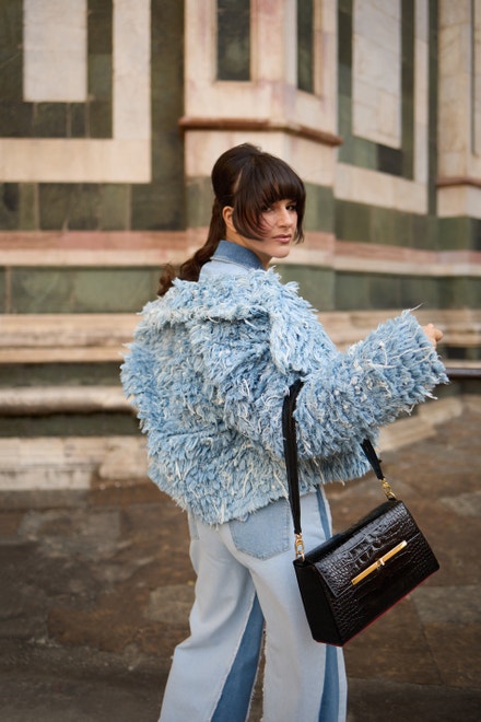 Denim trousers and ‘’faux fur’’ denim coat, KSENIASCHNAIDER; Black bag, Virag Kerenyi, Sandals, Fendi.