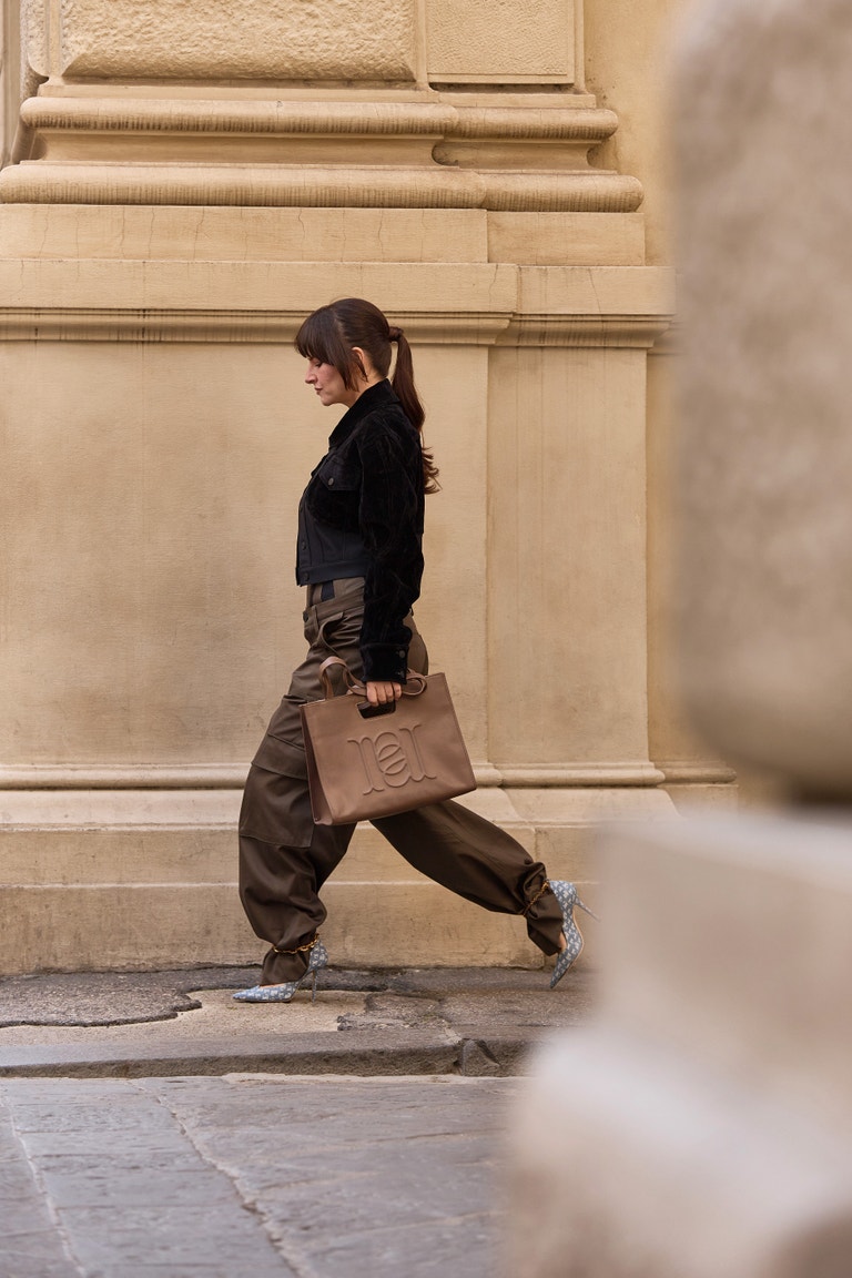 Bag, Anna Loch; Oversized trousers, corset and jacket, Mugler (VIA LUISA VIA ROMA); Shoes, Jimmy Choo.