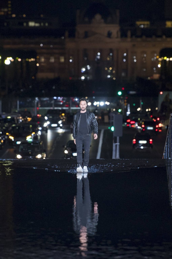 Anthony Vaccarello, Creative Director at Saint Laurent, walks on water at the Jardins du Trocadéro in Paris after his Spring/Summer 2019 show.