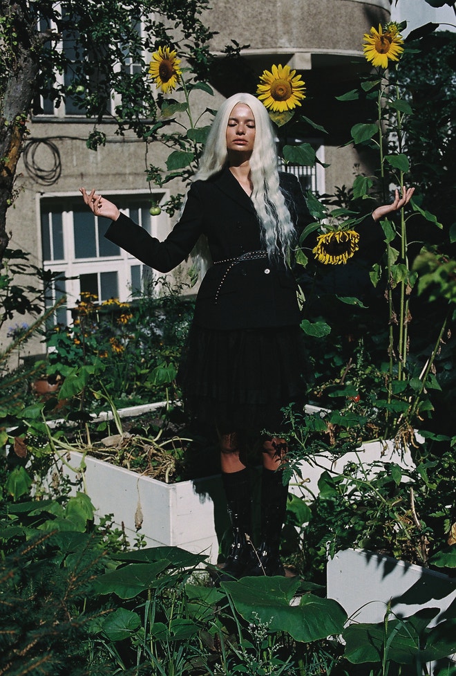 Jacket, skirt, belt, boots, socks, all Dior.