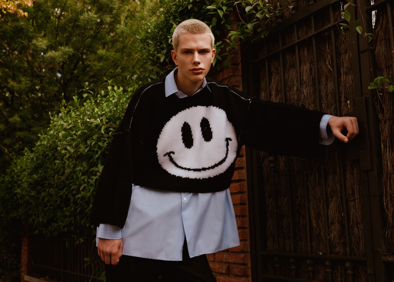 Sweater, Raf Simons; shirt, Christian Dior; pants, Louis Vuitton.